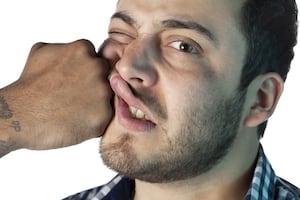 Man being punched in the face